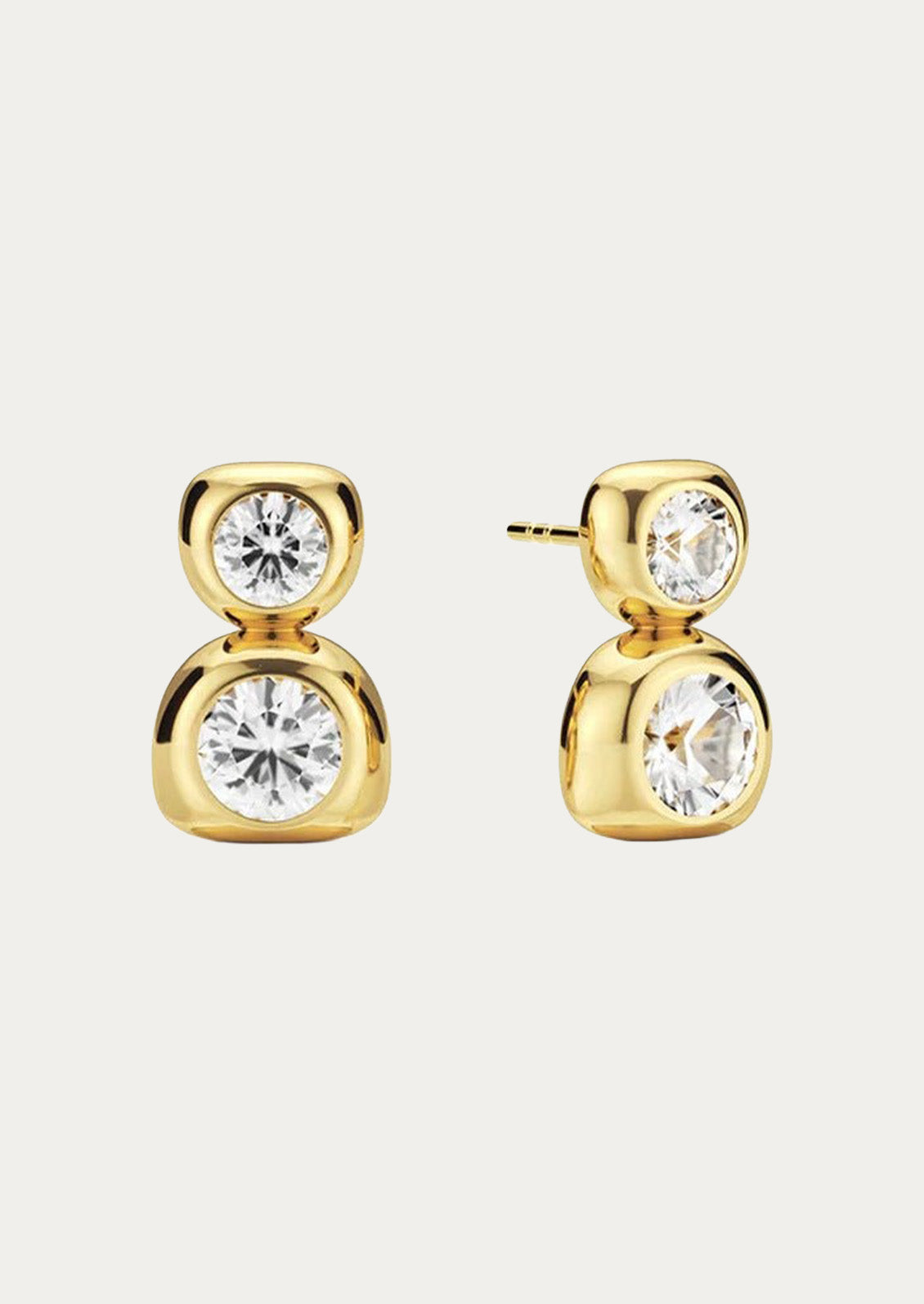 A pair of gold duo bezel stud earrings on a white background.