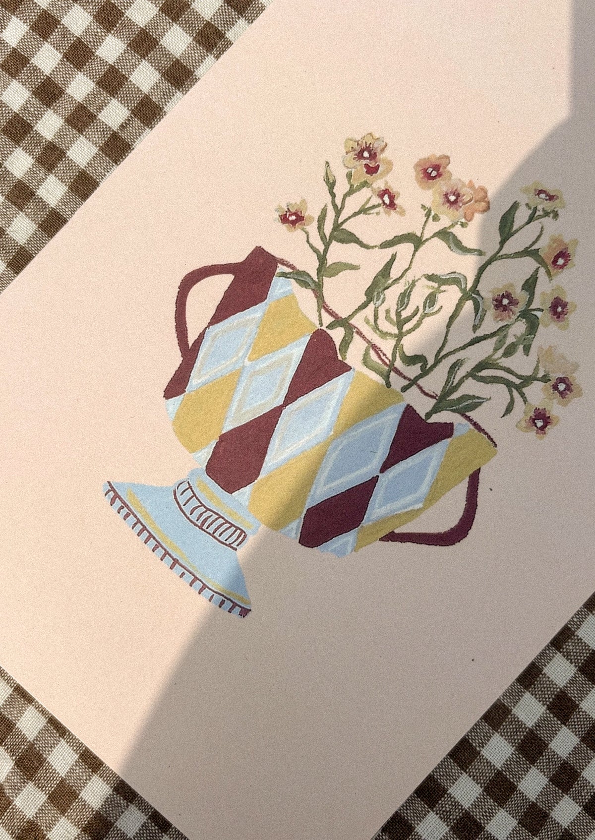 Decorative illustration of a patterned vase with flowers on a light background