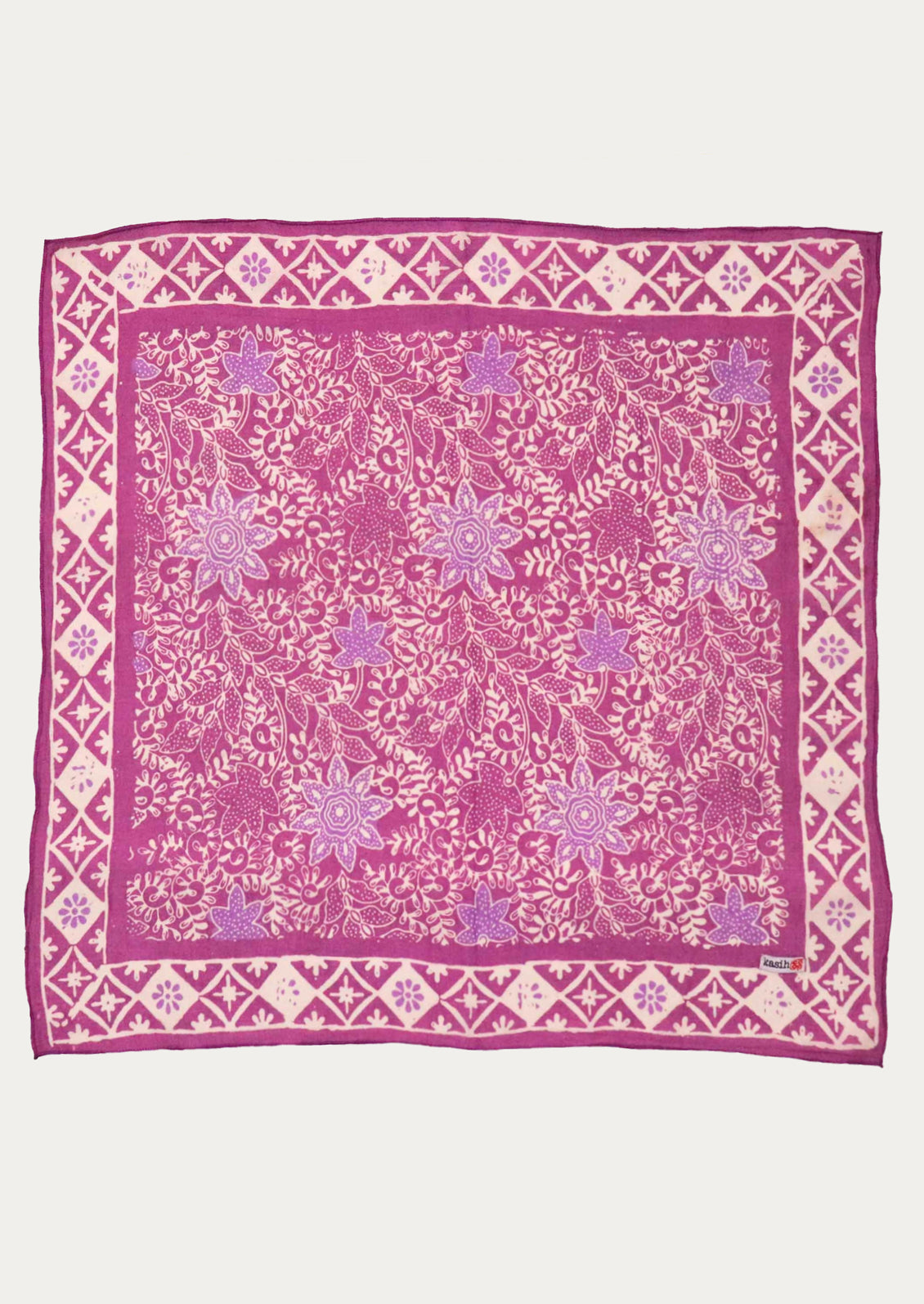A square scarf featuring a vibrant magenta and light pink floral block print pattern with a geometric border.
