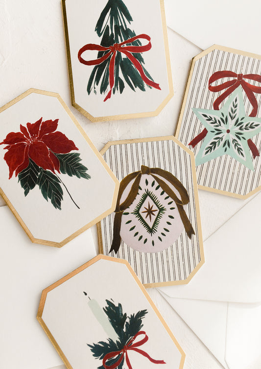 An assortment of holiday themed mini diecut greeting cards.