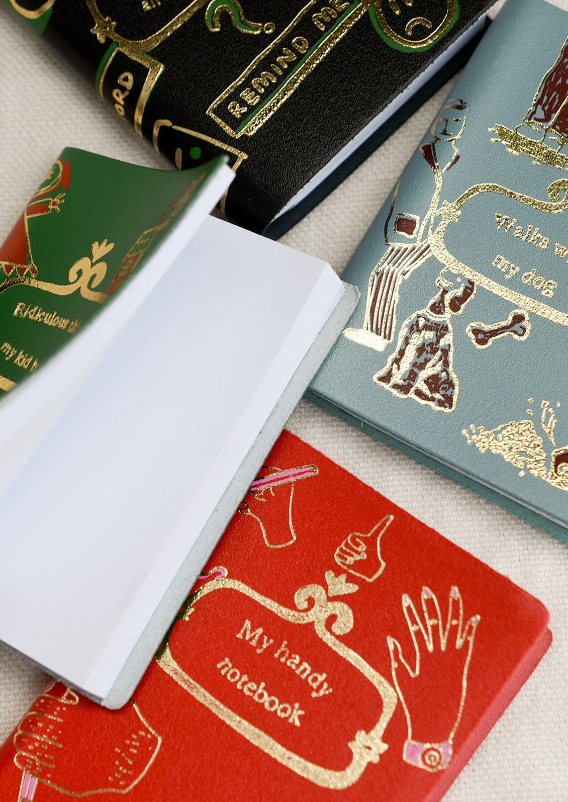 Assorted leather notebooks.