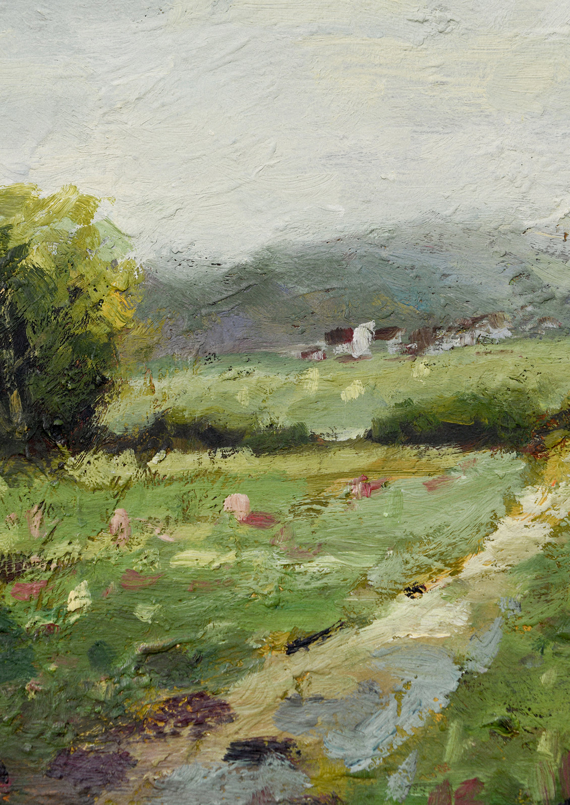 A framed original landscape oil painting of a green meadow with flowers.