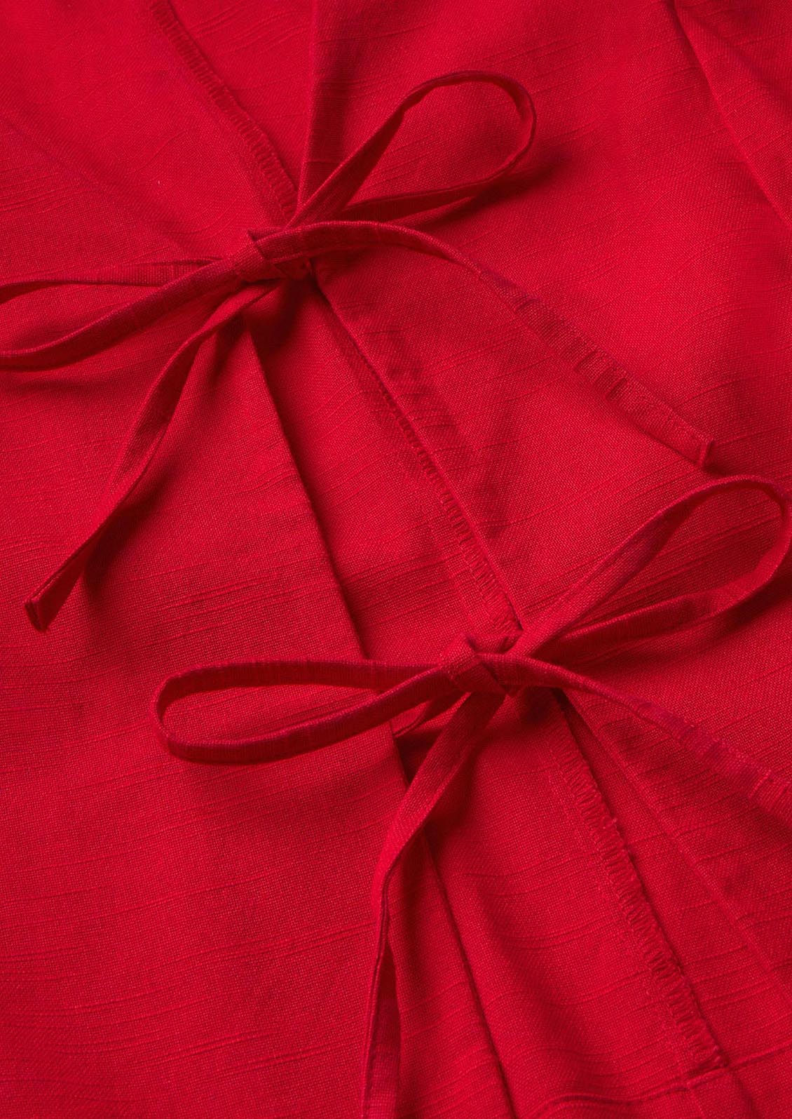 A red sleeveless top with front ties.