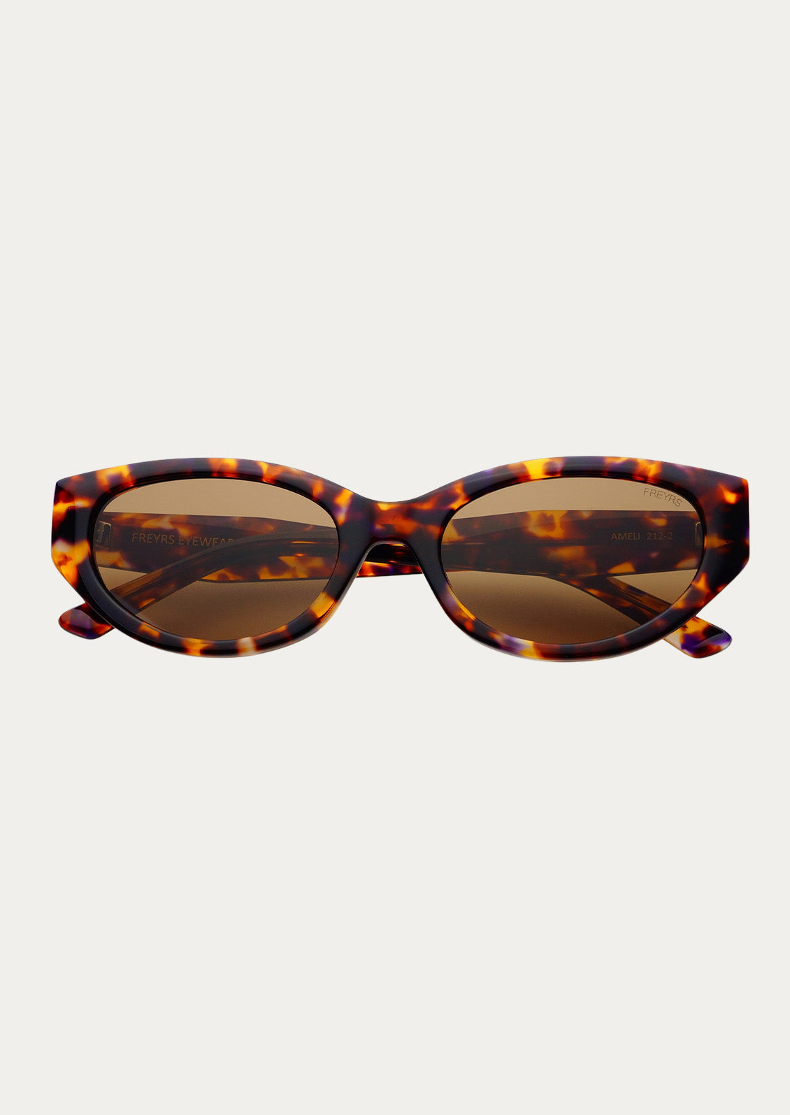 A pair of cat eye sunglasses with marbled tortoise frames and brown tinted lenses.
