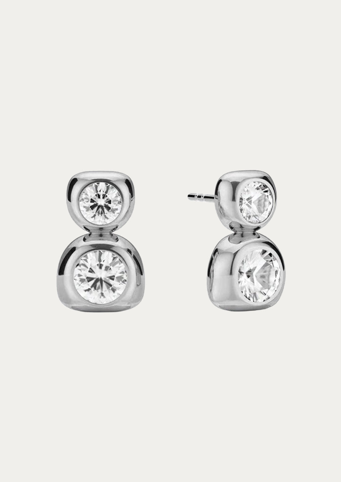 A pair of sterling silver duo bezel stud earrings on a white background.