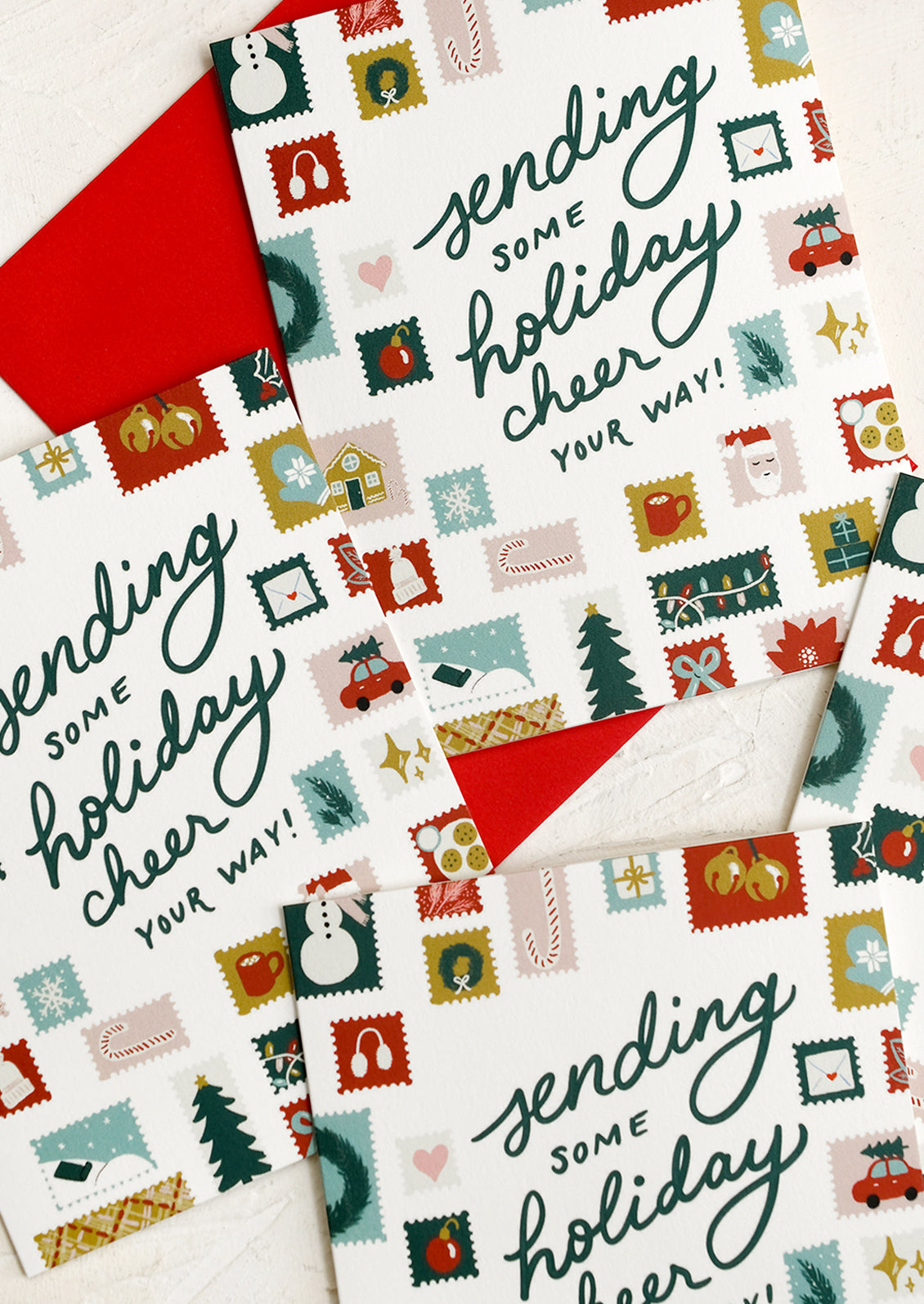 A holiday card set reading "Sending some holiday cheer your way!".