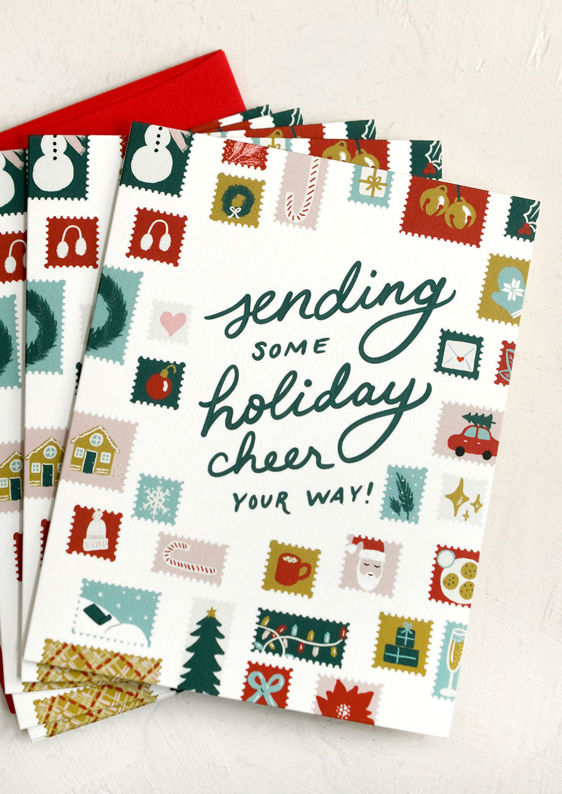 A holiday card set reading "Sending some holiday cheer your way!".