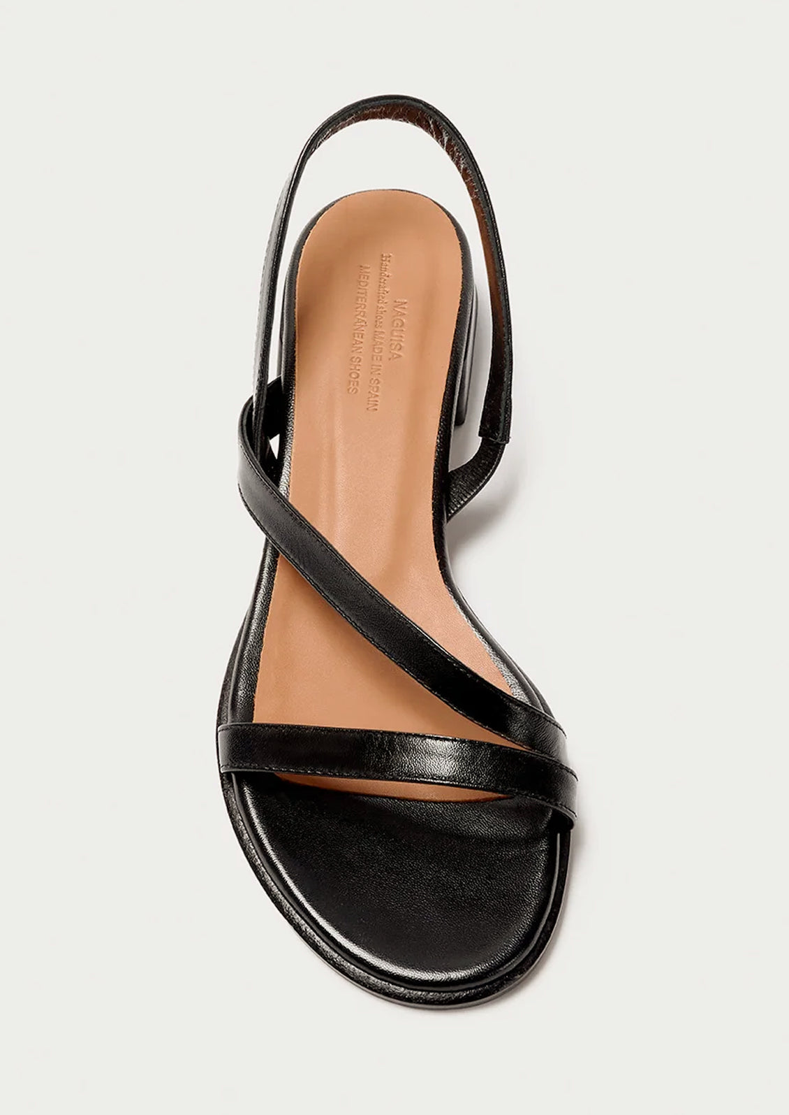 A strappy black leather sandal with a chunky heel.
