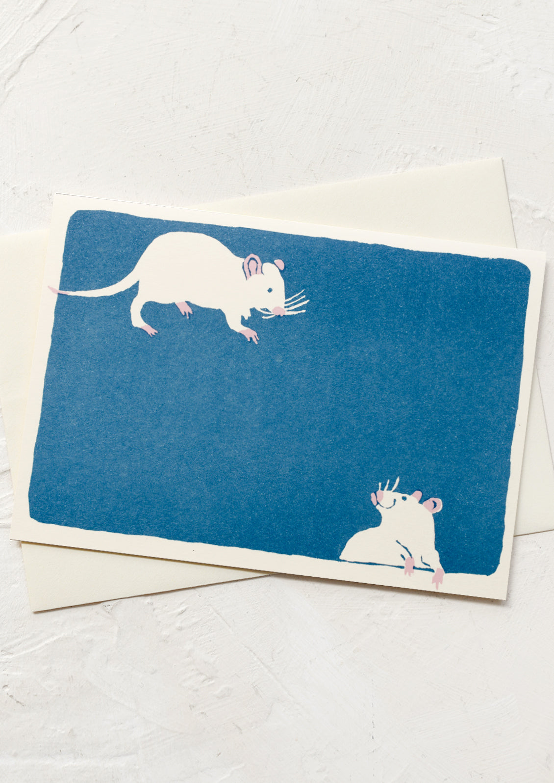 A blue greeting card with cheeky mice illustration.