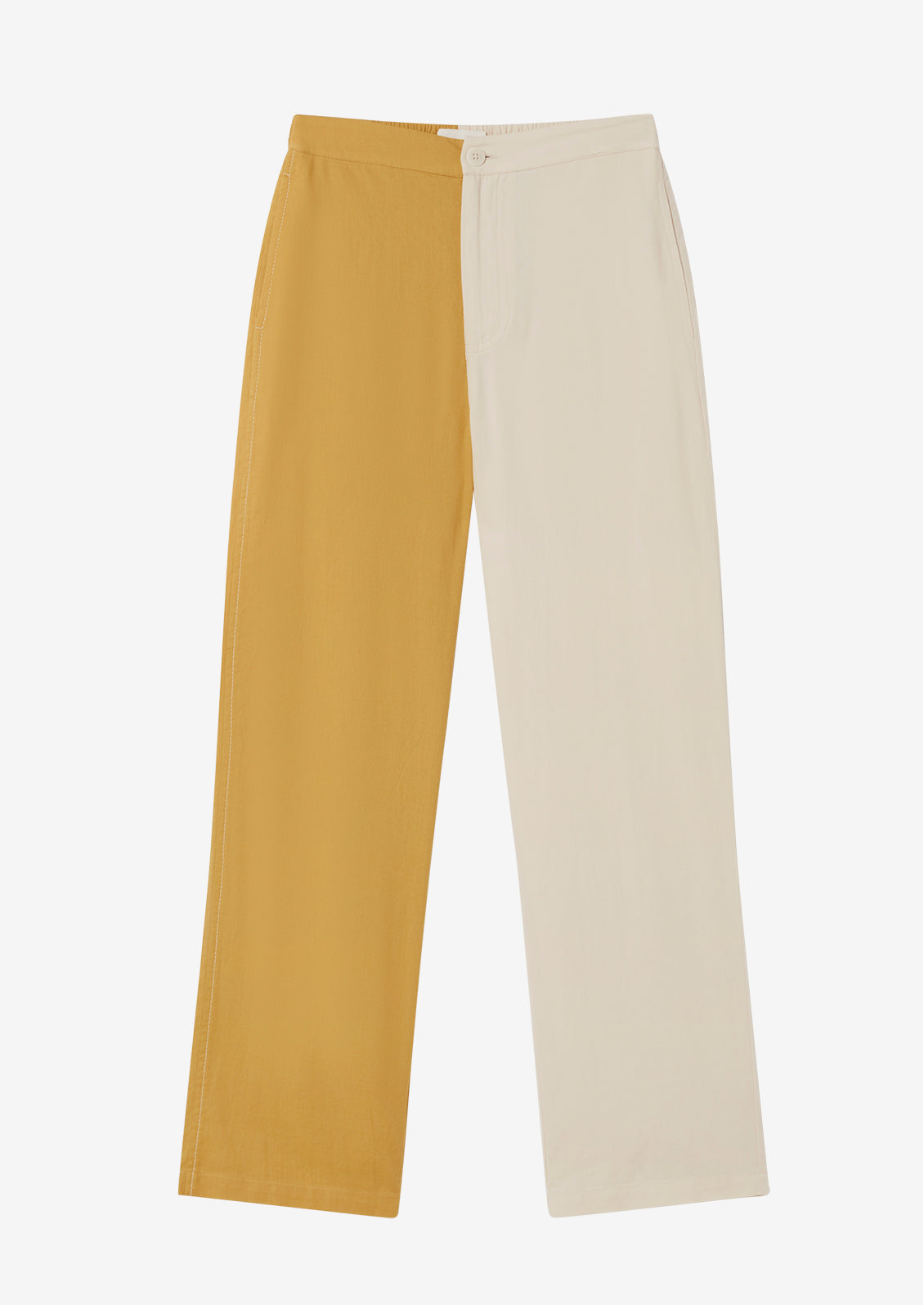 A pair of pants with one leg in yellow and one leg in cream.