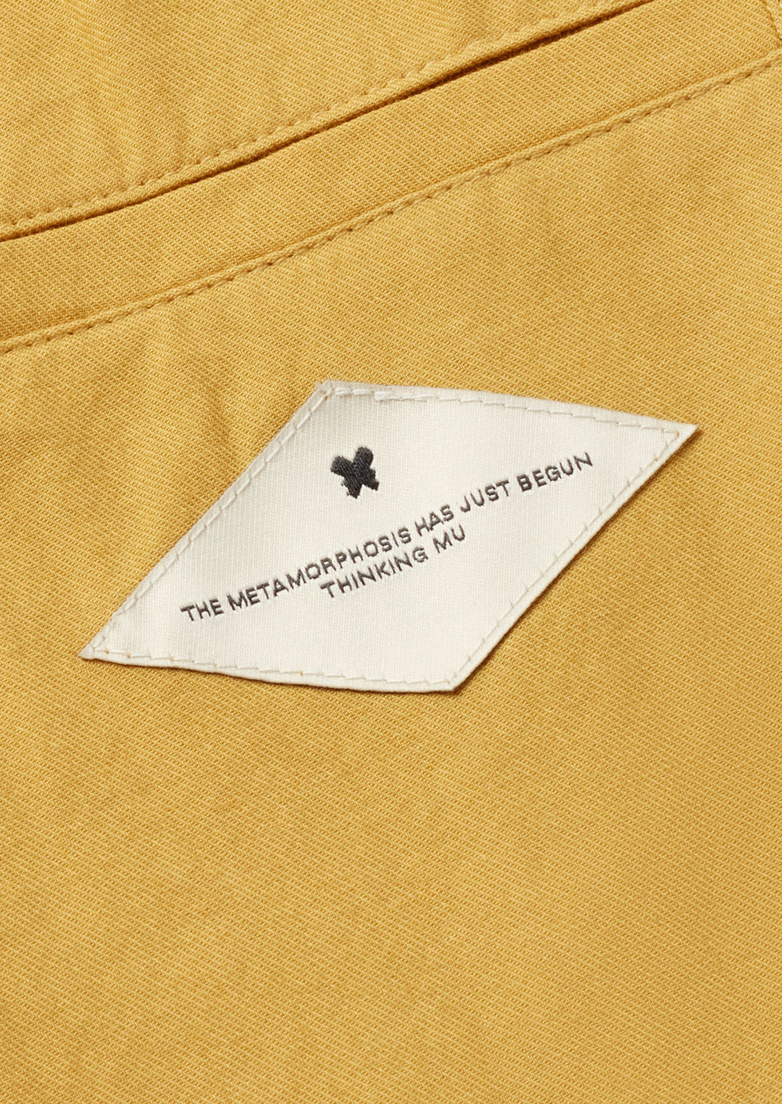 A logo text patch on back pocket detail.