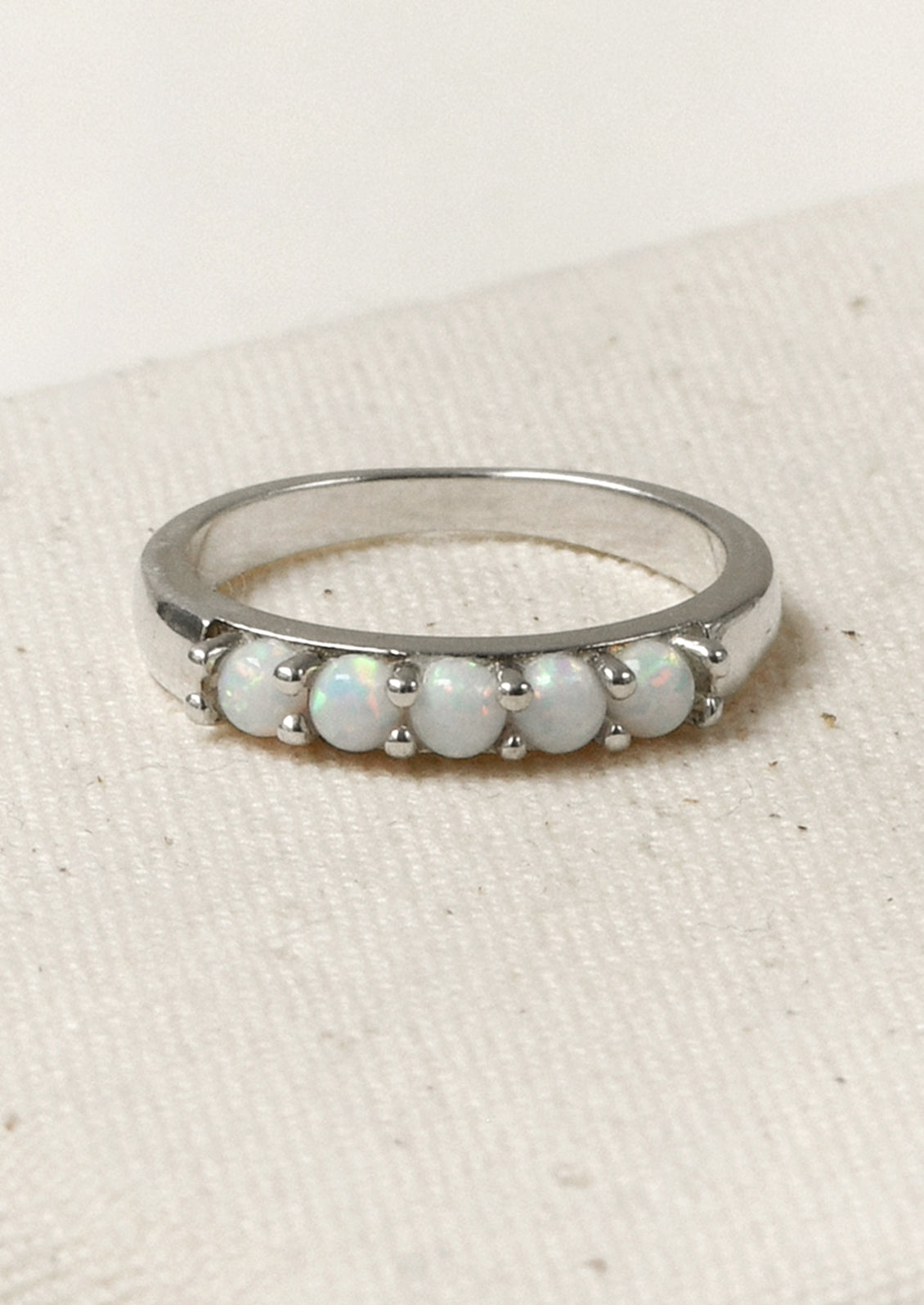 A sterling silver ring adorned with 5 opals.