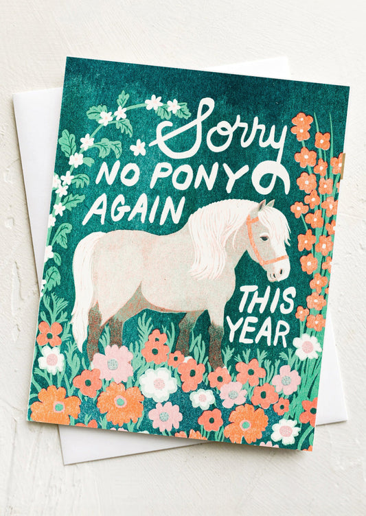 Card with a horse illustration and floral design, featuring text 'Sorry no pony again this year' on a white background.