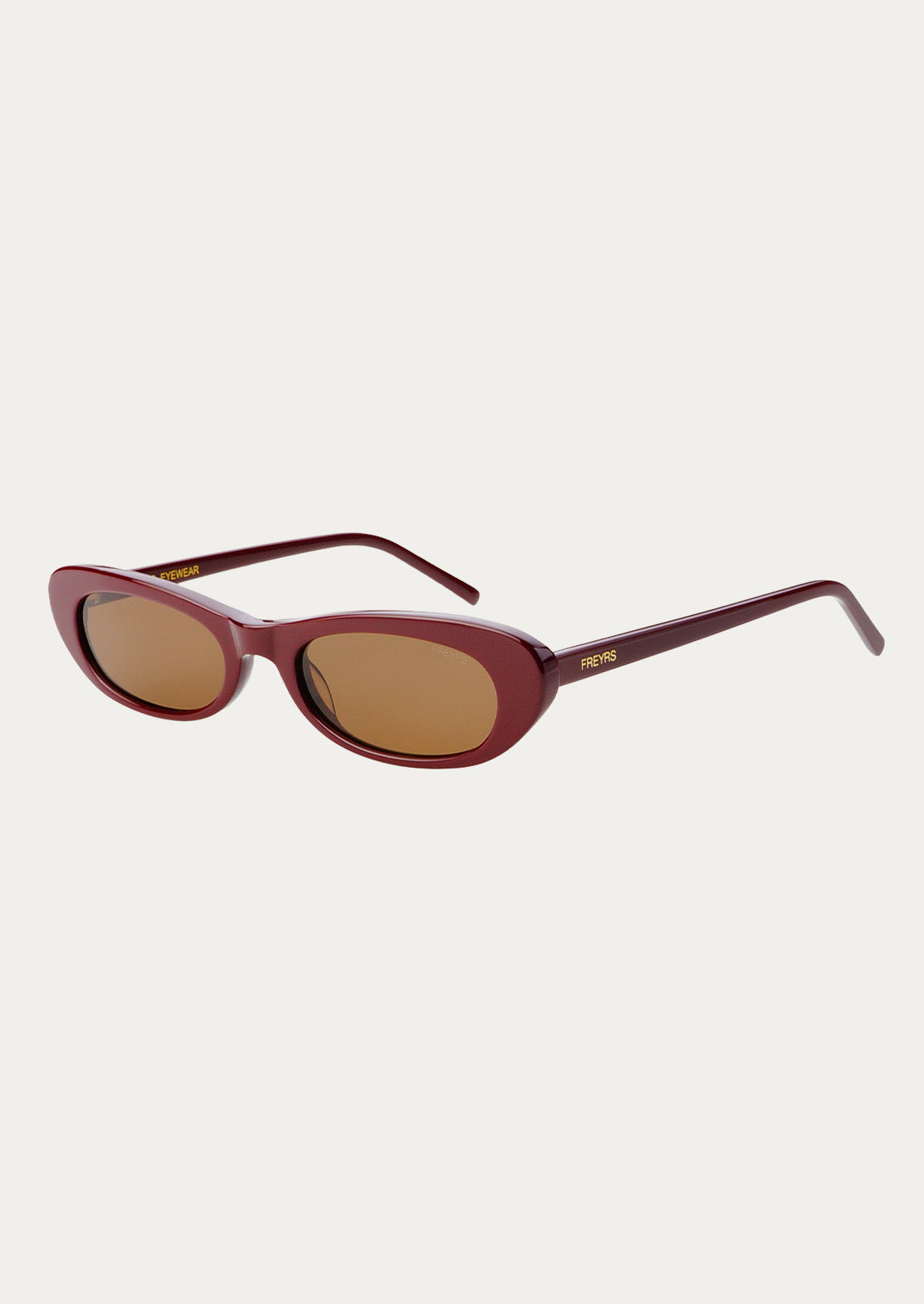 A pair of cat eye sunglasses with burgundy frames and brown tinted lenses.