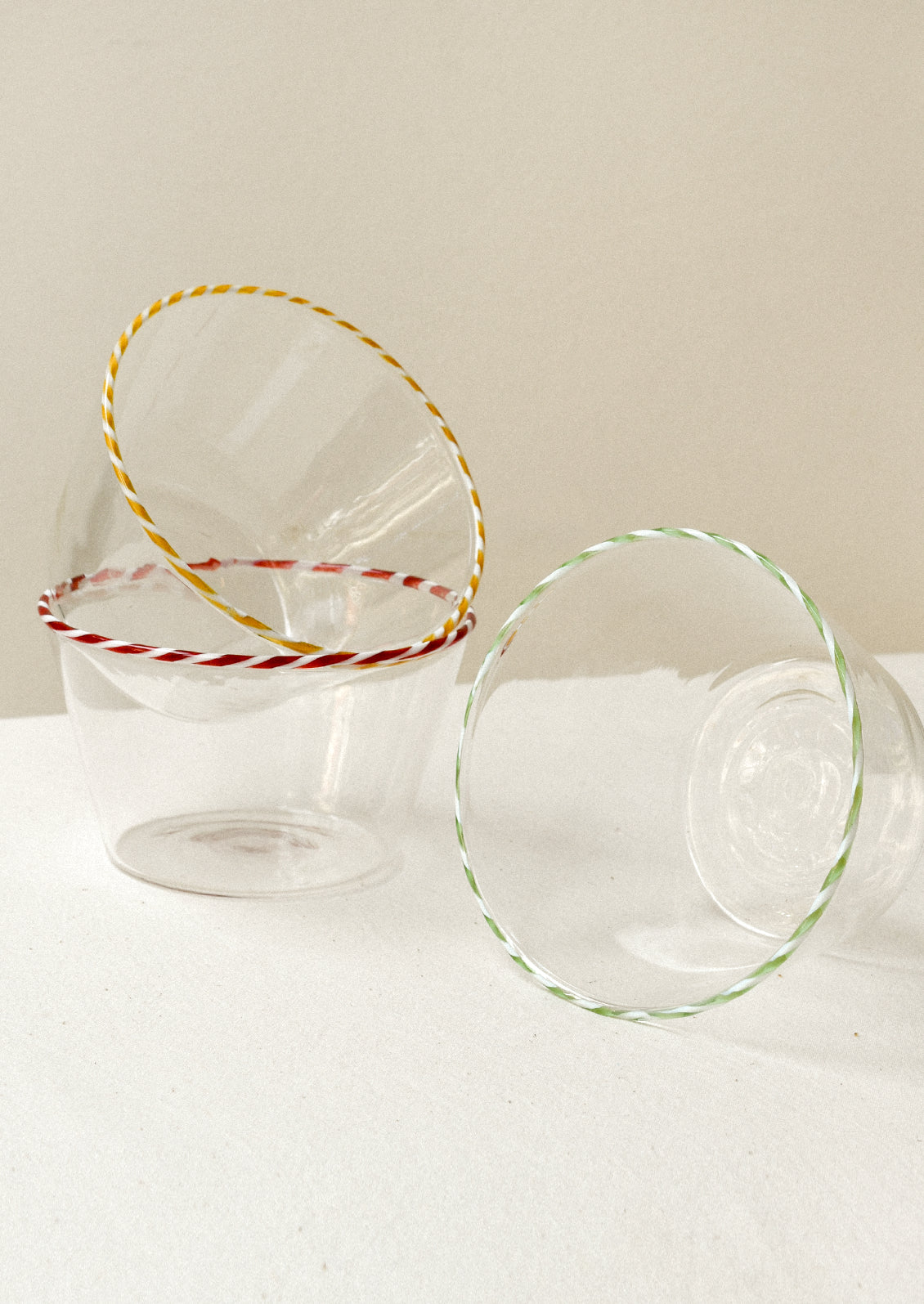 Clear glass bowls with colorful striped rims