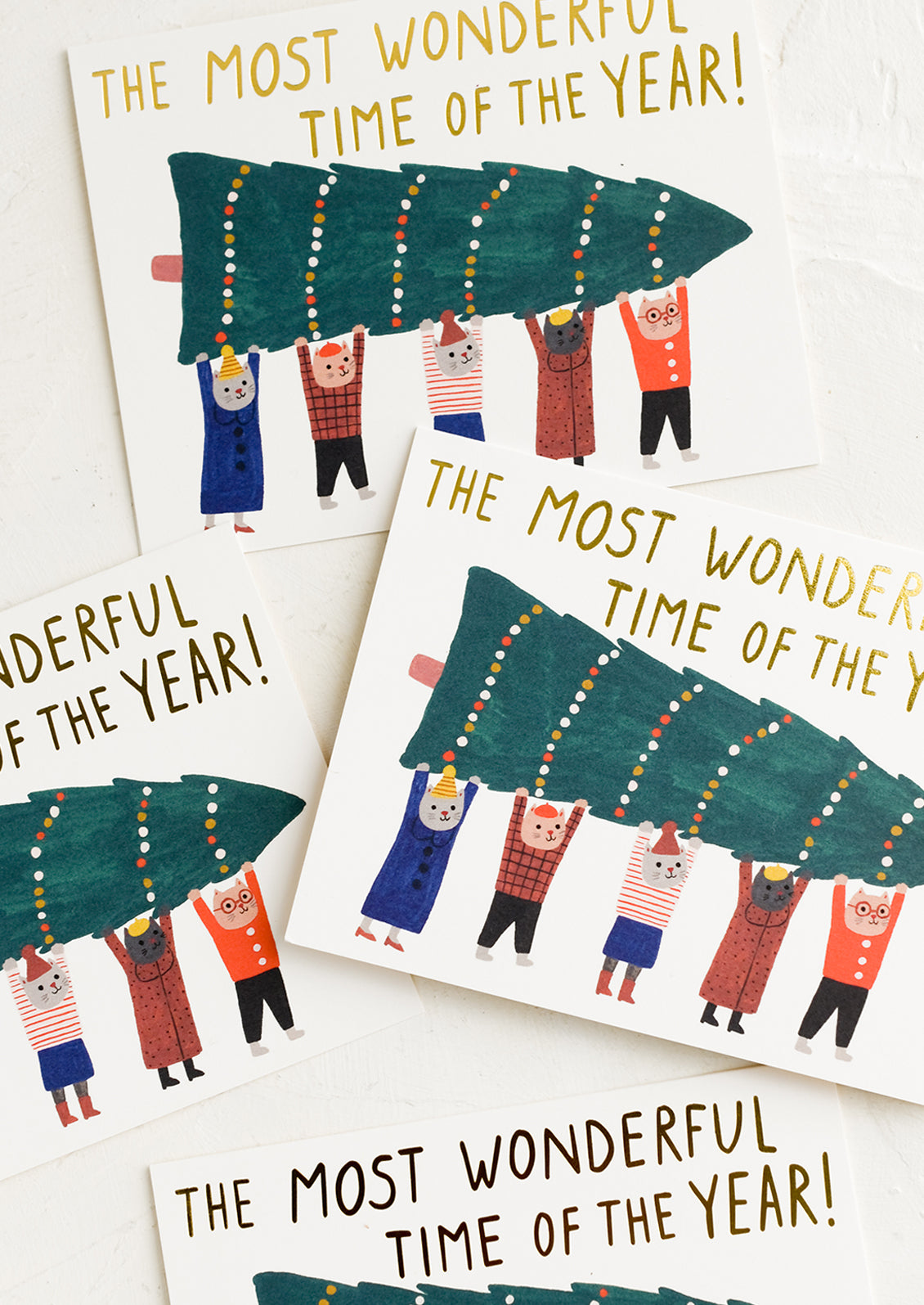 A christmas card set with cats holding up a christmas tree, text reads "The Most Wonderful Time Of The Year!".
