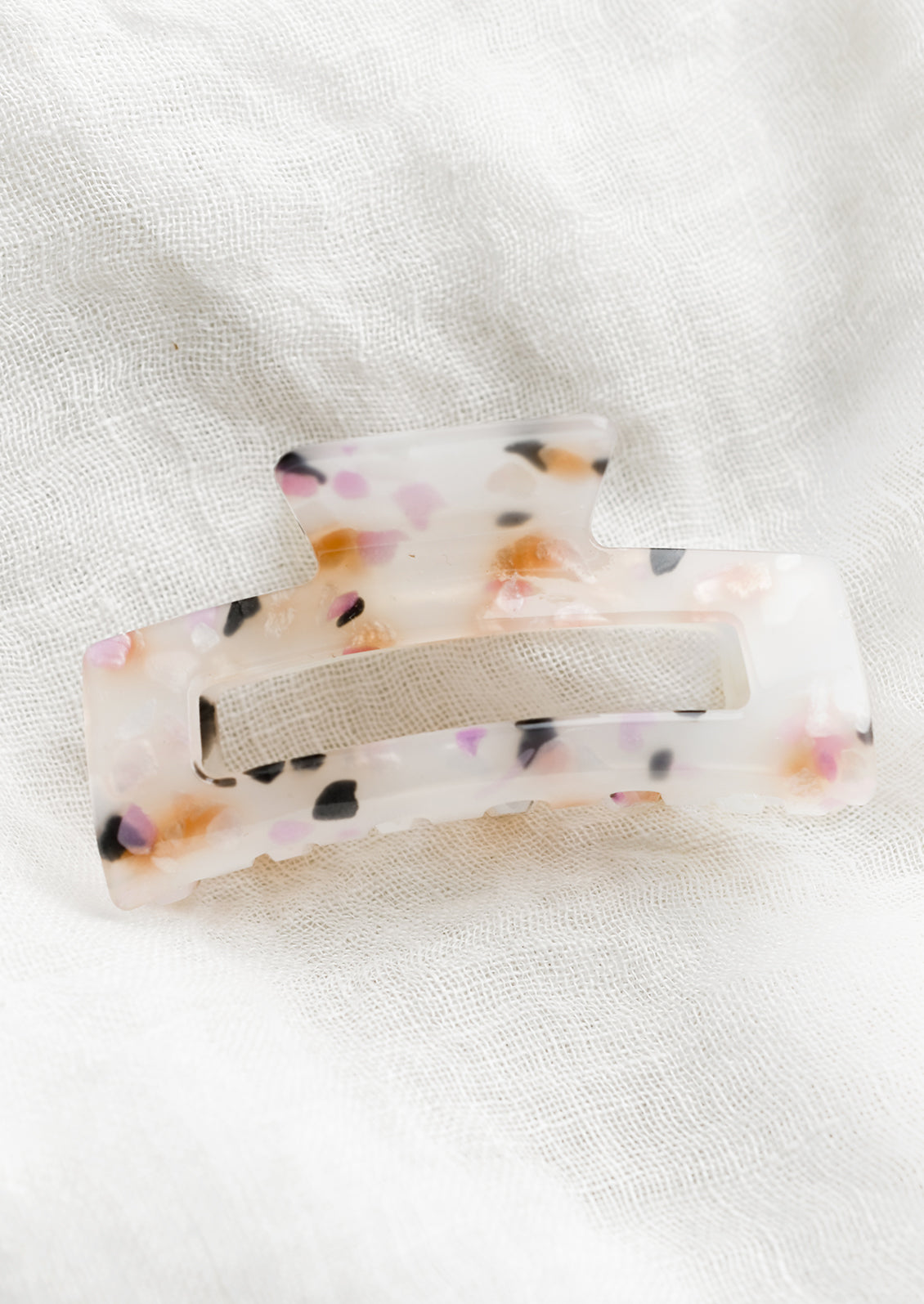 A color fleck hair claw in pink multi.