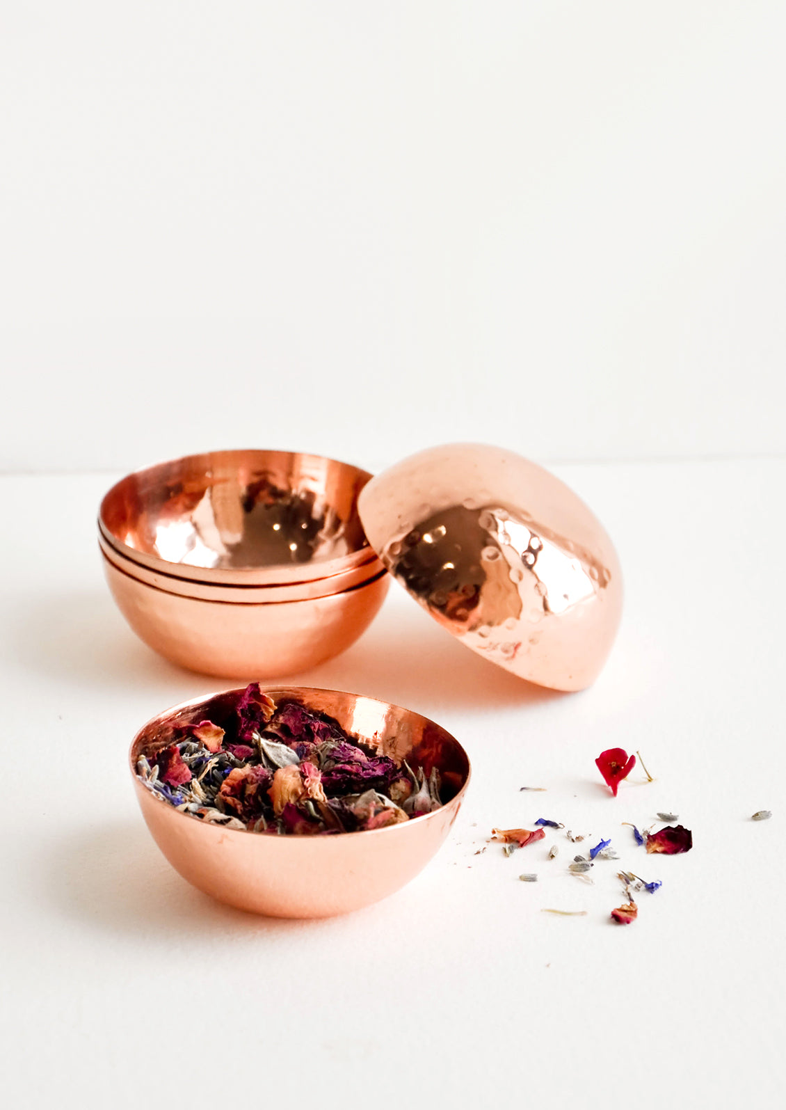 Small copper bowls with hammered texture