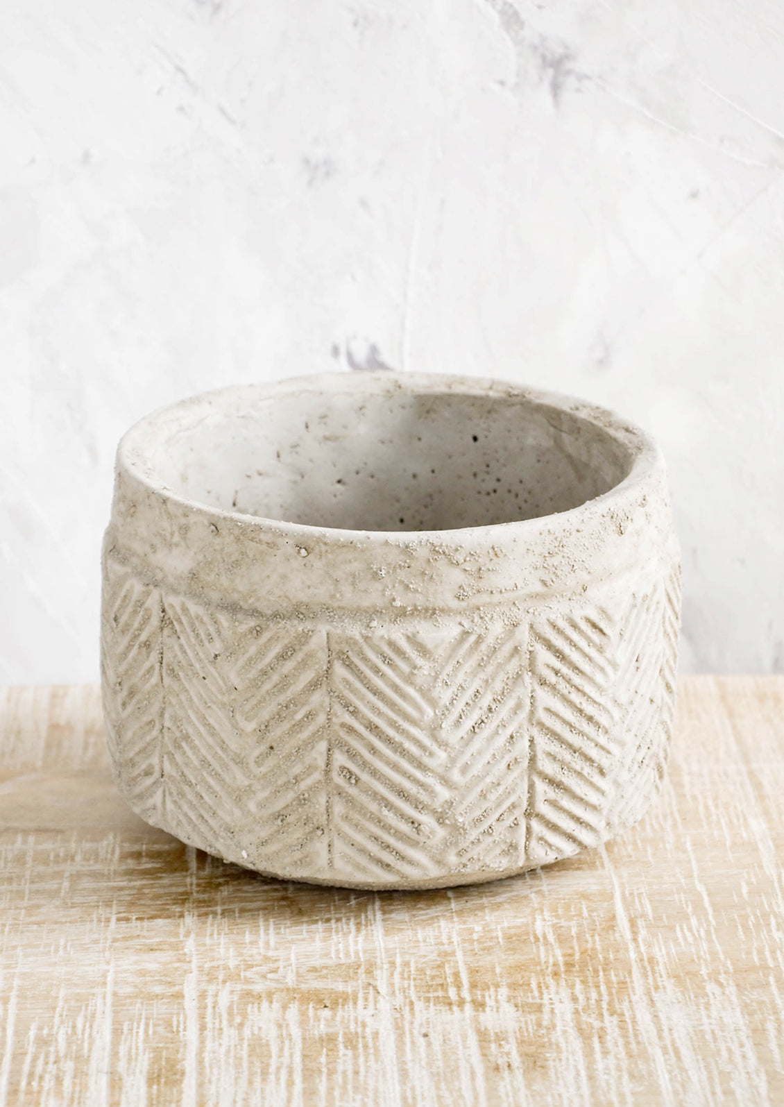 Distressed planter in concrete-like texture with chevron  detailing