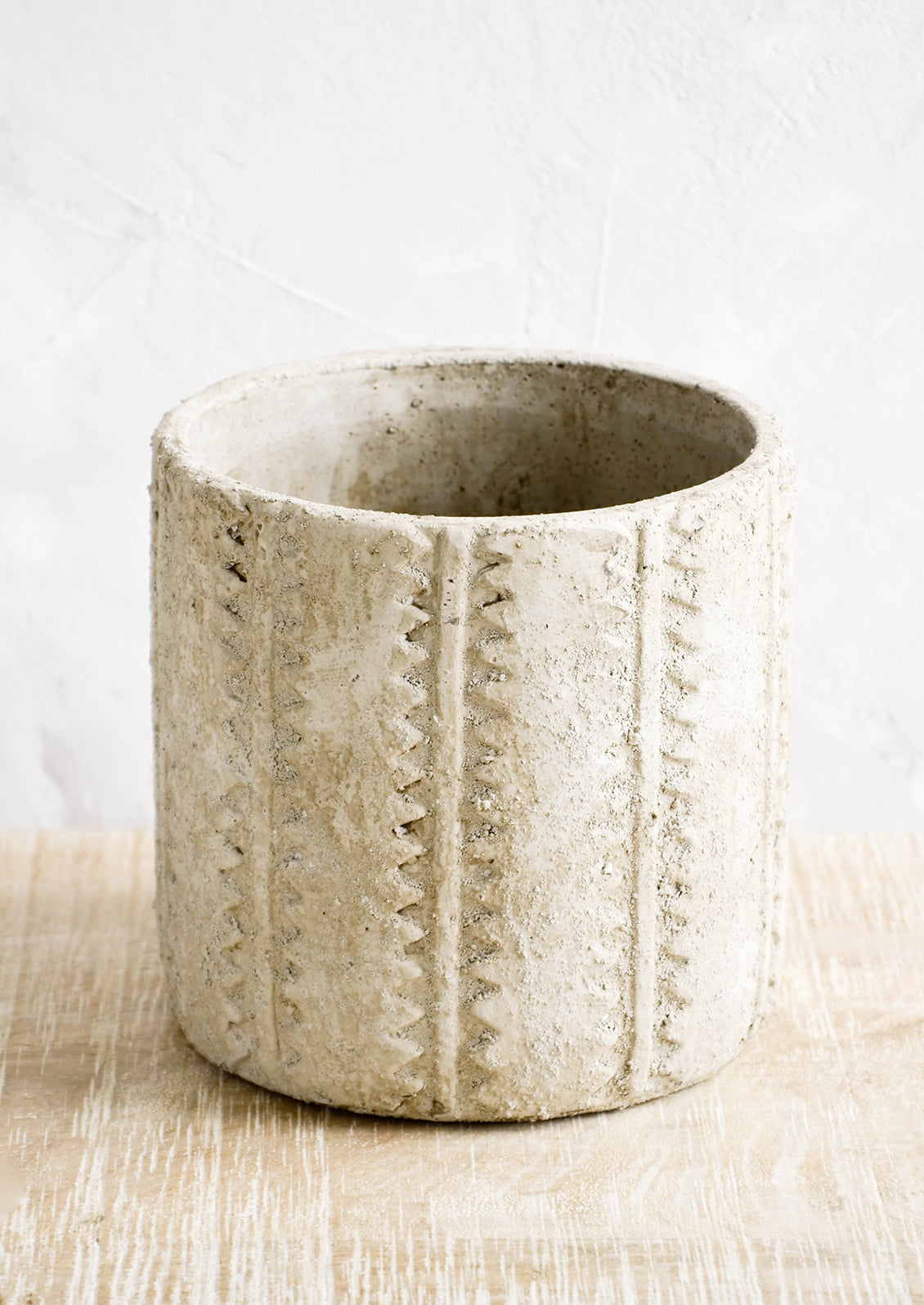 Distressed planter in concrete-like texture with stripe and zigzag detailing