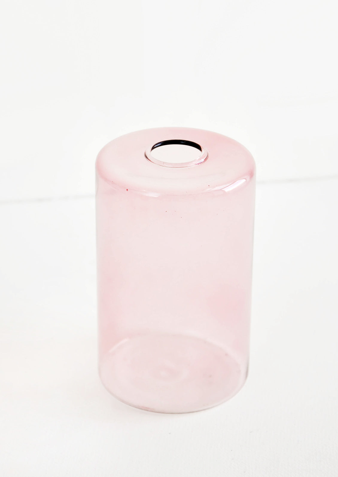 Colored glass flower vase in pink glass
